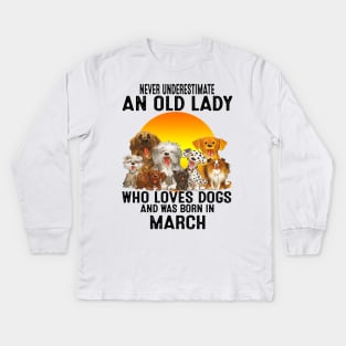 Never Underestimate An Old March Lady Who Loves Dogs Kids Long Sleeve T-Shirt